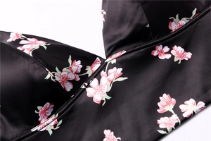 Detail of satin floral lingerie with smooth texture and high-quality stitching finish