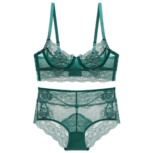 Deep green lace lingerie set featuring a sheer floral bra and matching scalloped panties