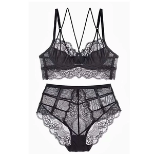 Sexy black lace lingerie set featuring sheer floral mesh and multi-strap push-up bra