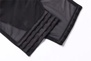 Detail of adjustable triple hook-and-eye closure on breathable black mesh shapewear fabric