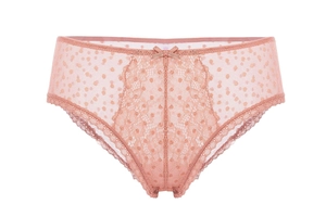 Detailed view of pale pink lace panties with floral patterns and a small bow