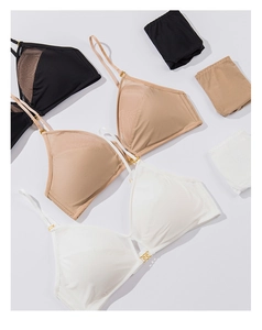 Detail of wire-free mesh lingerie sets with adjustable gold sliders in multiple colors