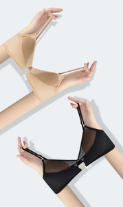 Detail view of seamless deep V bras with breathable mesh and gold buckle accents