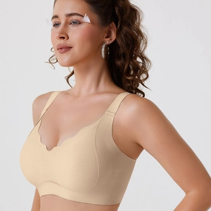 Close-up of seamless V-neck bra with scalloped edges and wide straps in beige