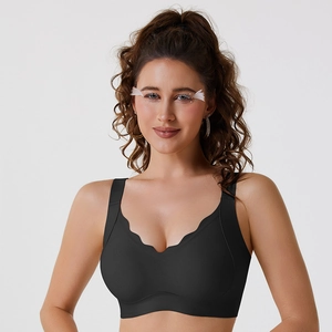 Seamless black V-neck bra with scalloped edges and wide straps for lift and comfort