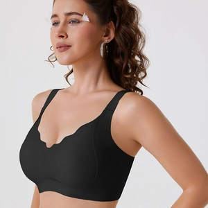 Detail of seamless black V-neck bra with scalloped edges and wide shoulder straps