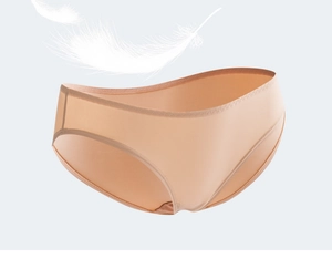 Detailed view of seamless beige panties featuring light feather decoration for softness