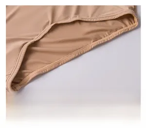 Detail of skin-toned seamless bra fabric showing precise stitching and hem craftsmanship