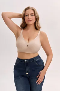 Close-up of seamless beige plus-size bra featuring wide straps and teardrop cutout detail