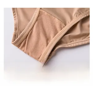 Close-up detail of breathable honeycomb fabric crotch on seamless beige panties