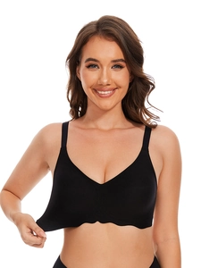 Detail of black seamless wire-free bra featuring soft fabric and wavy scalloped hem edges