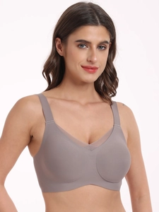 Detail view of seamless wire-free bra with mesh V-neckline and wide shoulder straps