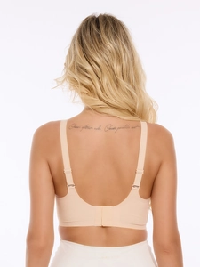 Macro shot of U-shaped back design with wide straps and jacquard wavy texture on nude bra