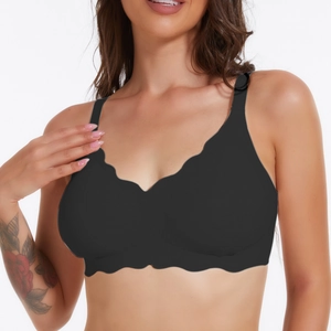 Detail of black seamless plus size bra with scalloped edges and wide shoulder straps