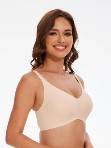 Close-up of seamless nude bra with wide side wings and broad shoulder straps