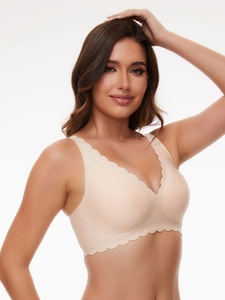 Close-up of nude seamless bra featuring scalloped edges and smooth wireless construction