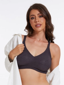 Detail view of seamless deep purple bra with elegant leaf vein pattern and wide straps