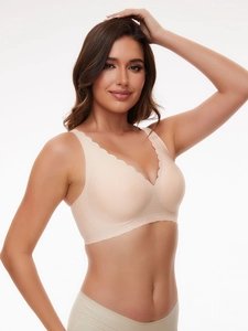 Seamless nude wireless bra featuring scalloped edges and smooth stretch fabric for comfort