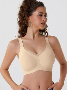 Close-up of seamless nude wireless bra with V-neck mesh trim and wide support straps