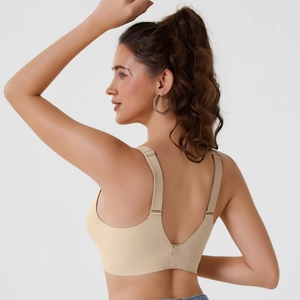 Seamless lifting wireless bra in beige featuring wide shoulder straps and a deep V back design