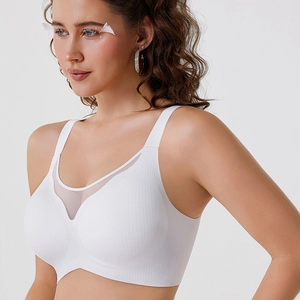 Close-up of white seamless bra with V-neck mesh detail and vertical ribbed texture