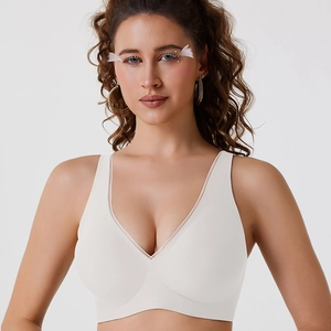 Seamless deep V-neck wireless bra in ivory white with delicate sheer mesh trim details
