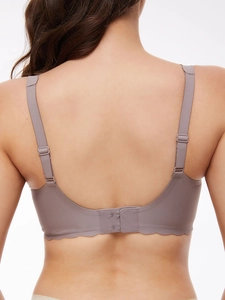 Detail of adjustable straps and seamless wavy laser-cut edge on purple jelly bra back