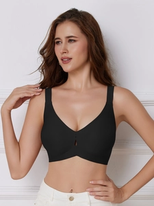 Close-up of seamless black deep V-neck bra with teardrop cutout and wide straps