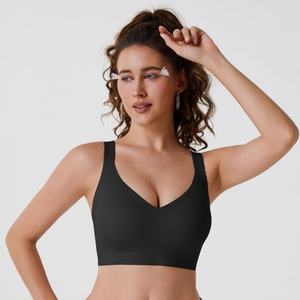 Seamless black push-up sports bra with wide straps and breathable micro-mesh fabric