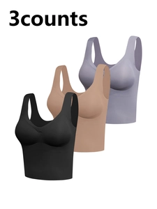 Three-pack seamless stretch sports tank tops in black, beige, and lilac colors