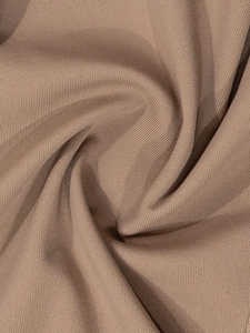 Detail shot of the breathable brown knitted fabric with soft texture and mesh pattern