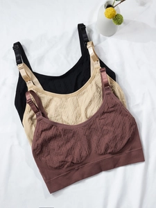 Detailed view of seamless nursing bra fabric texture with convenient buckle and wide band
