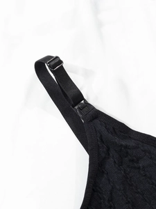 Detail view of adjustable black strap and buckle on seamless nursing bra for women