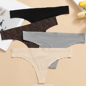 Set of four seamless thongs in black, grey, beige and leopard print on a beige background