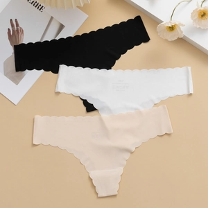 Three-pack of seamless ice silk thongs with scalloped edges in black, white, and beige
