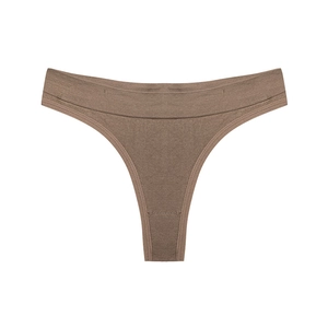 Detail of seamless dark beige thong featuring wide flat seams and fine fabric texture