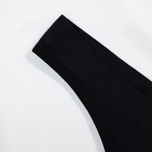 Seamless black thong for women made of premium breathable fabric with fine knitted texture