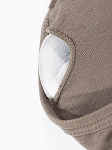 Detail view of the seamless ribbed fabric and removable chest pad pocket on a sports bra