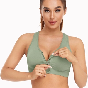 Green front zipper sports bra with wireless design and racerback for yoga and fitness