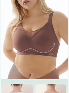 Detailed view of large size sports bra with V-neck mesh panel and wide logo hem