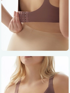 Detail view of the wide shoulder straps and four-row back closure on the seamless bra