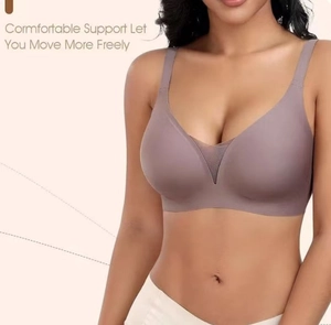 Detail of wide shoulder straps and V-shaped breathable mesh on seamless bra in lotus pink