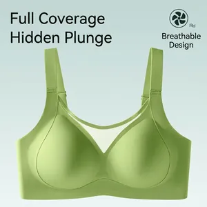 Light green seamless plus size sports bra with V-mesh detail and wide straps