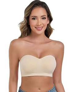 Detail of seamless beige strapless bandeau bra showing elastic matte fabric on model