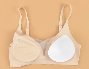 Detail showing removable bra pads and breathable mesh v-neckline on seamless bra