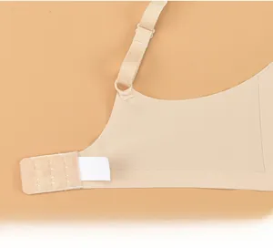 Detail of high-elasticity side wings and back hook closure on seamless nude bra