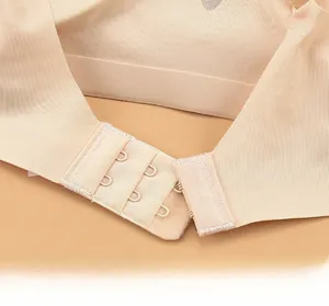 Close-up of skin-tone seamless bra with three-row two-button back hook-and-eye closure