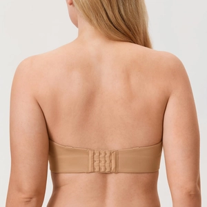 Nude strapless minimizer bra with multi-row hook closure and smooth back support