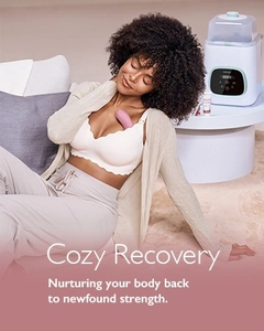 Pink ergonomic lactation massager for breastfeeding recovery in a home setting