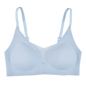 Seamless light blue push-up bra for women featuring V-mesh detail and adjustable straps